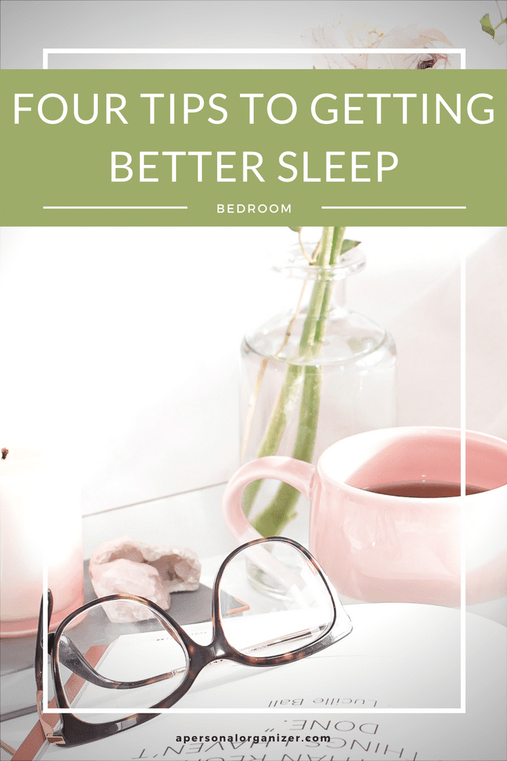 A cozy scene with a pair of eyeglasses resting on a book, a pink coffee cup, a white candle, and a flower in a vase. The text at the top reads "Four Tips to Getting Better Sleep - Bedroom." Website URL at the bottom: apersonalorganizer.com.