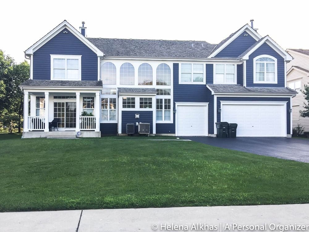 Single family home painted with Hale Navy by Benjamin Moore and white trims.