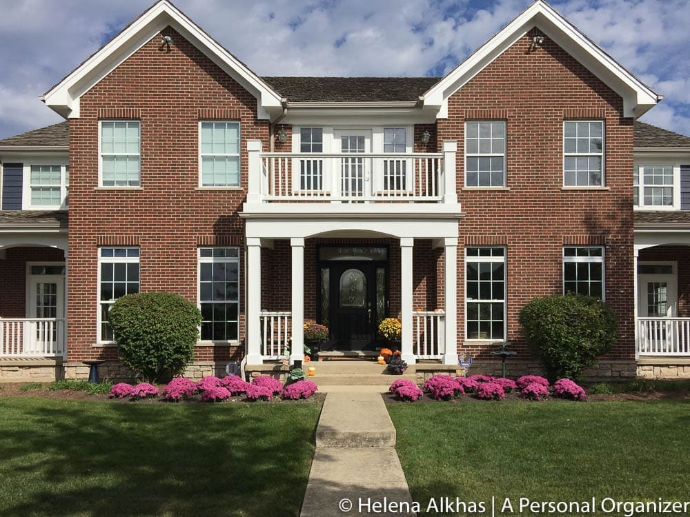 Brick House with White Trim & front flowery garden - A Personal Organizer