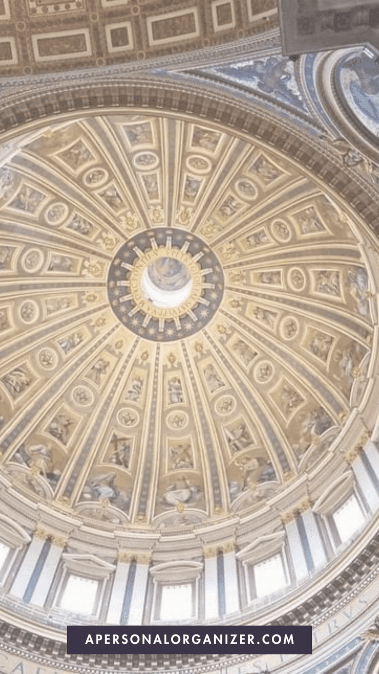 A close-up of the intricate ceiling of St. Peter's Basilica in Rome, highlighting the cultural and religious sites to visit and how to dress respectfully.