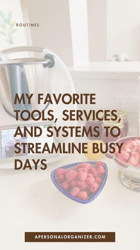 A kitchen counter with a bowl of raspberries, a bowl of strawberries, and a kitchen appliance. Overlaid text reads: "My favorite tools, services, and time saving hacks for moms to streamline busy days.