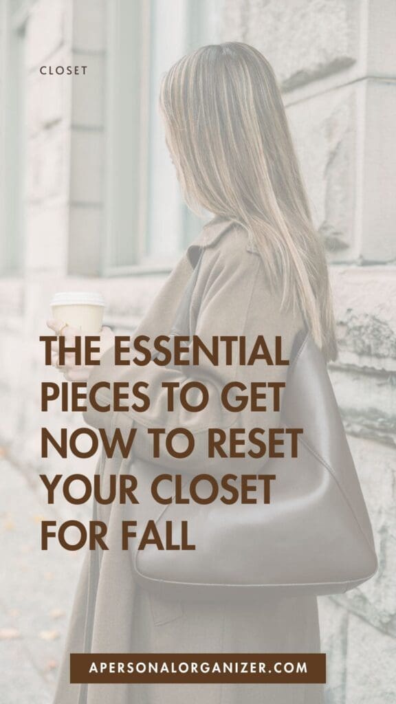 A woman with long hair, wearing a brown coat and carrying a large dark brown bag, holds a coffee cup. Text reads: "The essential Fall Outfit Ideas to get now to reset your closet for fall." Website: apersonalorganizer.com.